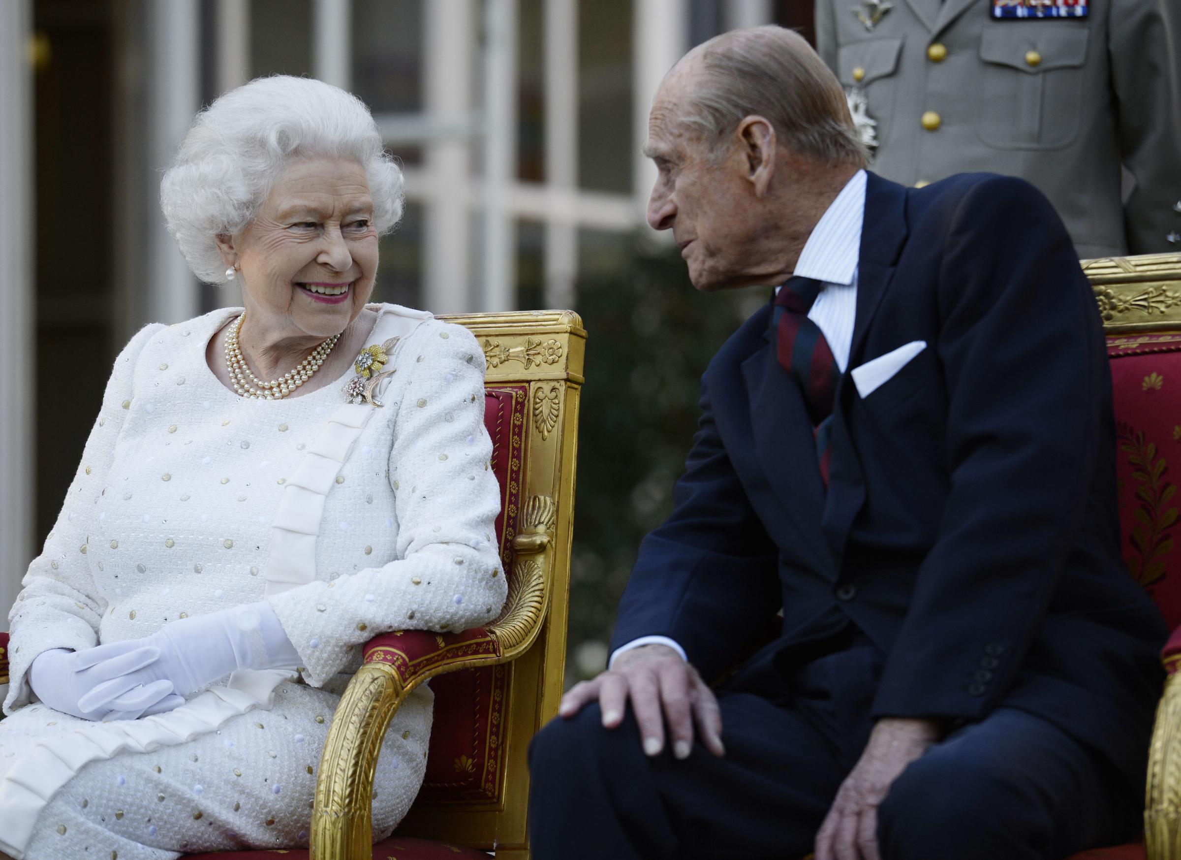 File photo dated 05/06/14 of Queen Elizabeth II and the Duke of Edinburgh attending a garden party in Paris, hosted by Sir Peter Ricketts, Britains Ambassador to France ahead of marking the 70th anniversary of the D-Day landings during World War II.