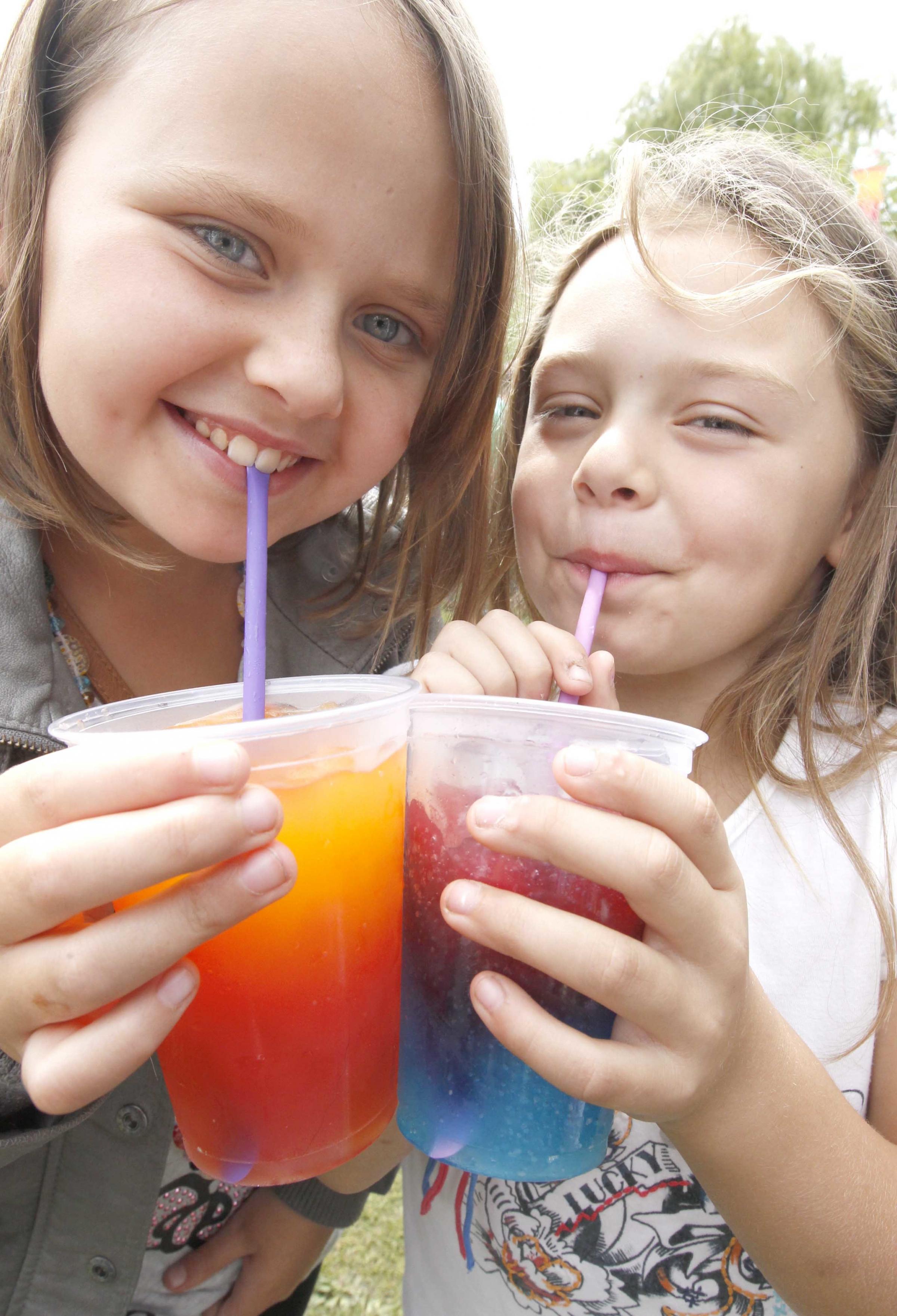 Straw poll - Courtney and Ferne Farmer enjoy a colourful slushy drink. The sisters were ten and five respectively when this picture was taken