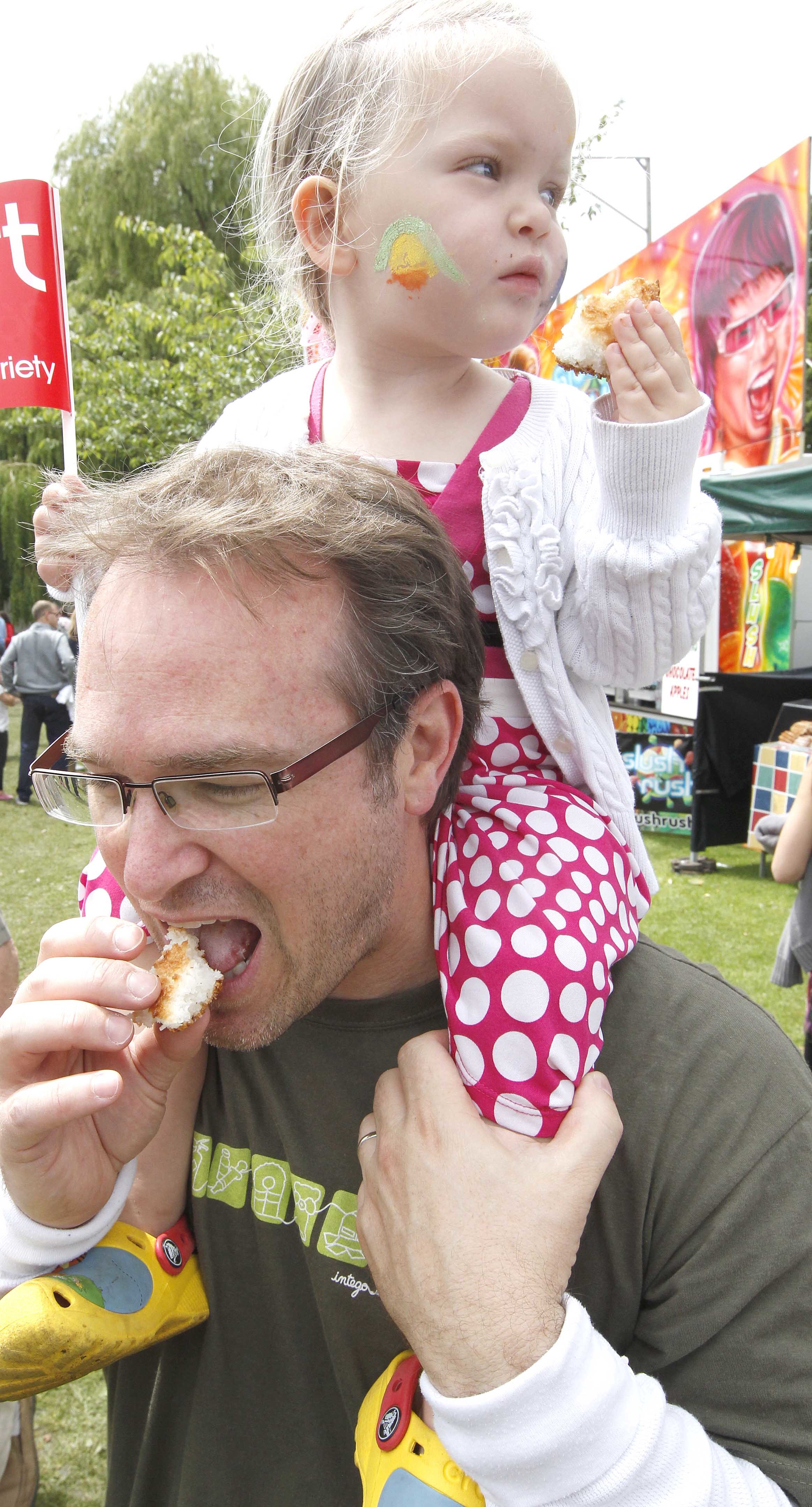 Best seat in the house - Alan Parfitt and three-year-old daughter Anna tuck into some of produce on offer at the 2011 Food and Drink Festival