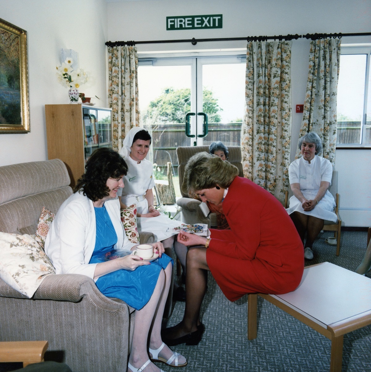 Handiwork - patient Pauline Budd presents a tapestry she had completed at the Joan Tomkins day centre to Princess Diana