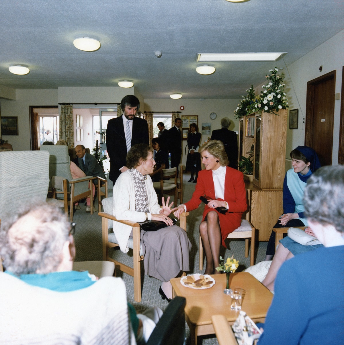 Friendly word - the royal visitor chatting to a patient about her once-a-week visit to the day centre