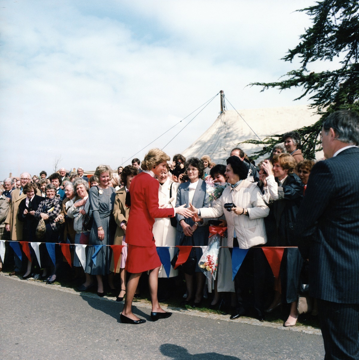 Centre of attention - Princess Diana dazzles the adoring crowd of volunteers, hospice staff and patients’ families