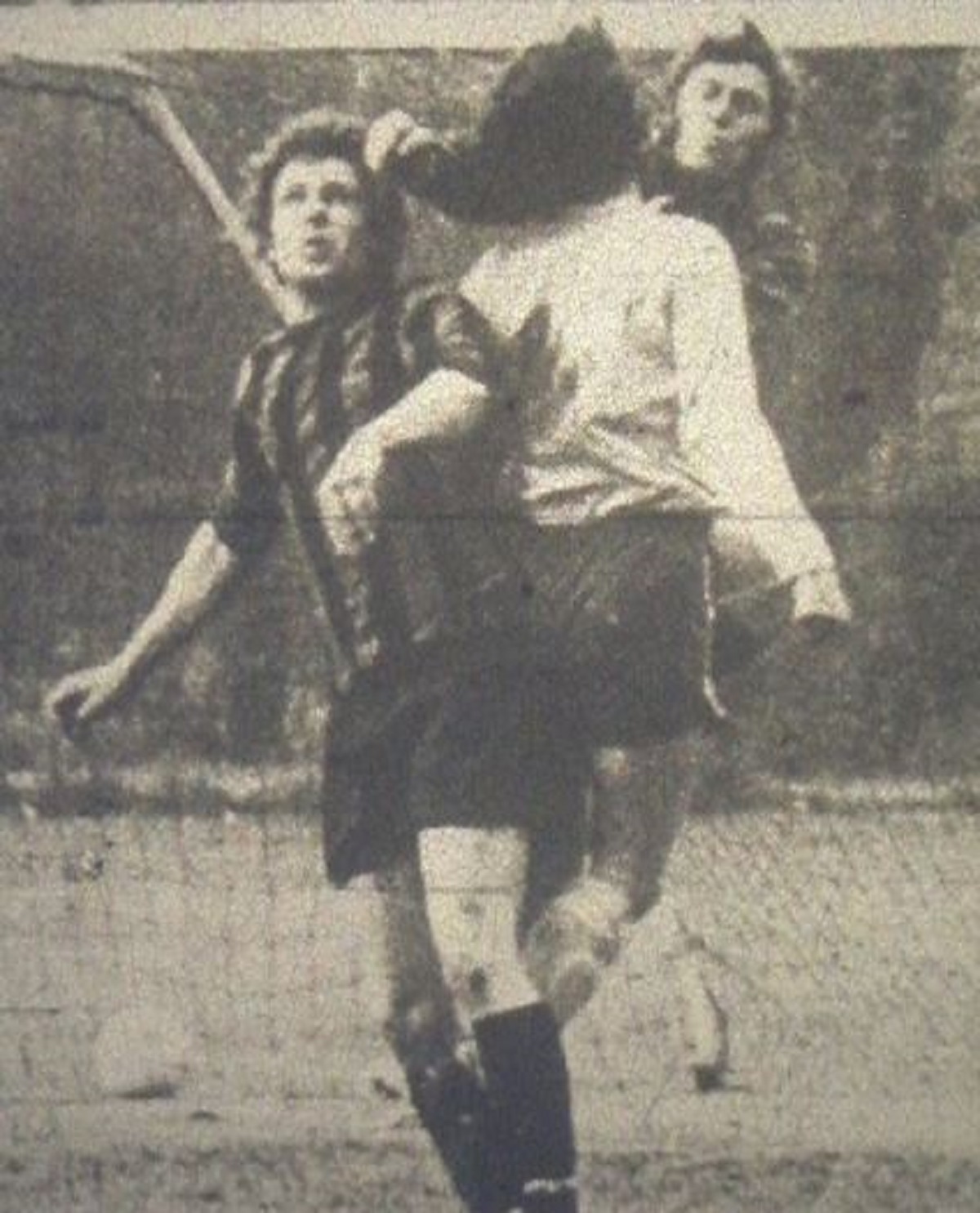 Thick of the action - Live and Let Live defender Terry Simmons (light shirt) clears from an Elmstead attacker. This picture was taken during one of the 1973/74 League Cup semi-finals. Live and Let Live ended up winning 3-2