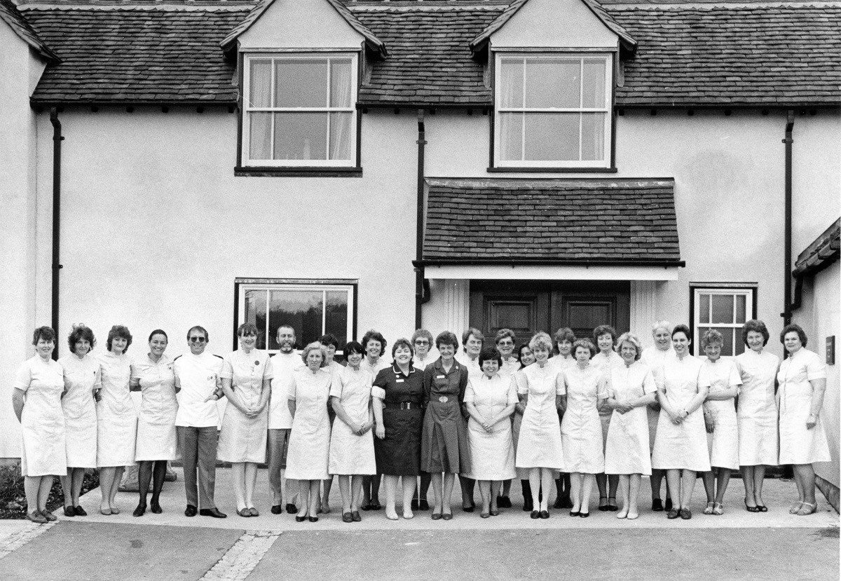 Nursing team - staff outside the front of the hospice, the refurbished Myland Hall in Colchester, ready to welcome the first patient in May 1985