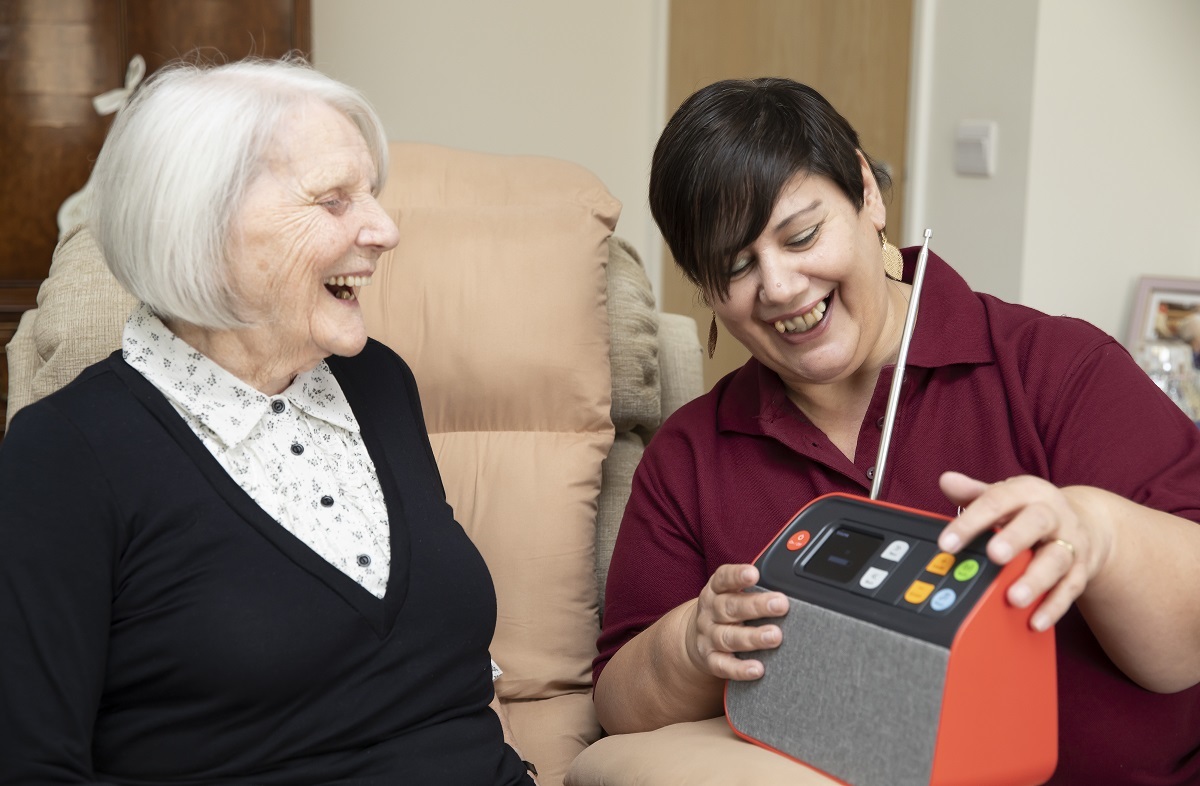 The sounds of time - Jean Kidd enjoys her radio and is pictured with CAREgiver Lesley Simca Picture: STEVE BRADING