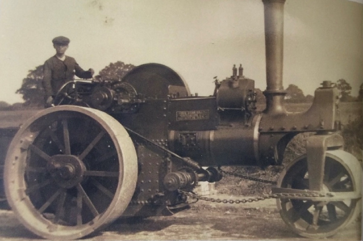Building up a head of steam - Marys grandfather, Ernest Sawyer. He left school at 12 and was in charge of this steamroller at the age of 17