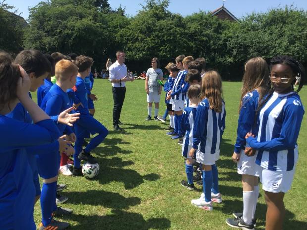 Gazette: Giving their all - Year 6 children at Highwoods Community Primary School took part in a special fundraising football match organised by Olly Fulcher