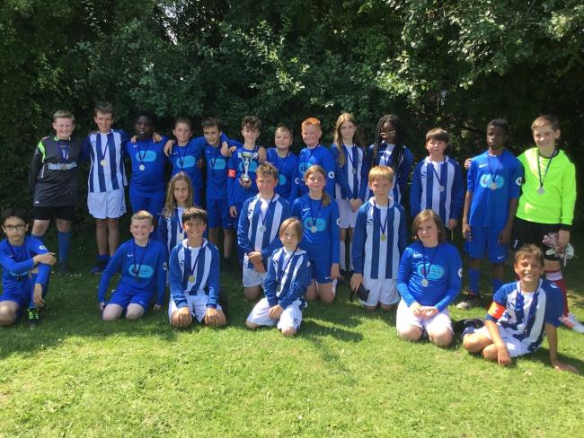 Giving their all - Year 6 children at Highwoods Community Primary School took part in a special fundraising football match organised by Olly Fulcher