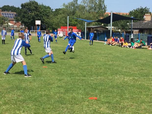 Gazette: Giving their all - Year 6 children at Highwoods Community Primary School took part in a special fundraising football match organised by Olly Fulcher