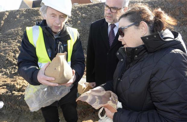 Gazette: Colchester Archaeological Trust dig at a site close to where Cants of Colchester was..Philip Crummy (left) show Cllrs Tim Young and Anne Tyrrell pottery found at the site.