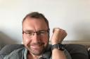 Paul Hutton with his Apple Watch at home in Bradfield