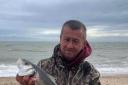Key catch: Mark Oxley with the bass that helped him win the latest Colchester Sea Angling Club match.