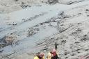 Maryport Coastguard Rescue Team mud training. Photo: Denis McCallig