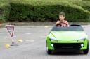 Speedy - A young driver behind the wheel of the scaled down Firefly Sport
