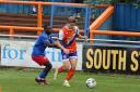 On the ball: Tom Blackwell in action for Braintree Town in their victory against Worthing.