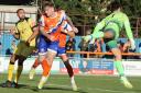 High kicks: Joe Grimwood battles it out for Braintree Town against Chesham United in the FA Cup.
