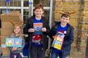 Book lovers - Lily-Mai, Max Hunter, and Liam Hunter are set to donate more books to children staying in Essex hospitals over the Christmas period (Image: Lorraine Hunter)