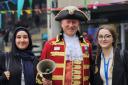 Celebration - Colchester's town crier Robert Needham visited the university in celebration of Essex Day, in the picture with Fatima Ramadan (left) and Margaux Bonbony (right)