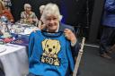 Hero - Marjorie Culham, 77, and the knitted jumper she received for her 60 years of service