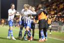 On the scoresheet - Cameron McGeehan celebrates with his Colchester United team-mates after scoring against Stockport County
