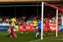 On target - Tom Hopper scores Colchester United's opener in their 3-2 win at Crawley Town