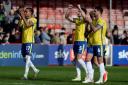 Away success - Colchester United's players applaud their fans after the 3-2 win at Crawley Town on Saturday