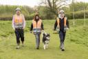 Andrea and a couple of members of the site team walking Lexi