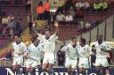 Big moment - Colchester United's players celebrate after David Gregory scored from the spot against Torquay United, at Wembley Stadium