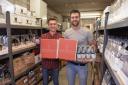 Brothers in arms - Evan Herbert, right, with brother, Alex, among their beer stock