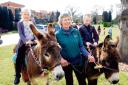 Sue Field with donkeys Aaron and Benji ridden by Alanah Easton and brother Brandon