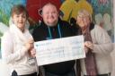 Smiles - Caroline Bates, head of fundraising, with Adam Jones and mum Shirley