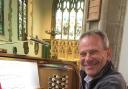 Cheerful - Antony Watson at the church organ console.