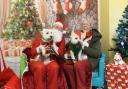 Adorable - Karl Upsher dressed as Father Christmas with Sheila Claydon and her westies Isa and Fin.