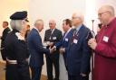 Moment - King Charles speaks with Colchester councillor Darius G Laws and then Colchester High Steward Sir Bob Russell