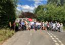 Fight - campaigners stand in front of the now closed-off Boxted Bridge