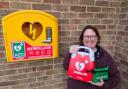 Happy - Angela Linghorn-Baker with the new defib at St Cedd's Church