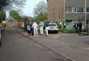 Police and forensic officers at the scene in Bourne Court