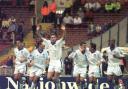 Big moment - Colchester United's players celebrate after David Gregory scored from the spot against Torquay United, at Wembley Stadium