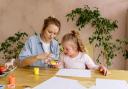 A teacher and student with SEND engage in creative finger painting at a table indoors. (Image: Pexels,  Antoni Shkraba)