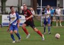 Jamie Shaw (in stripes) scored Coggeshall's second goal at Wroxham