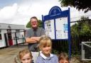 Defiant - headteacher Clive Middleditch with pupils Maddie Springett, Amelia Wakelin and Ella Castleton at Elmstead Primary School