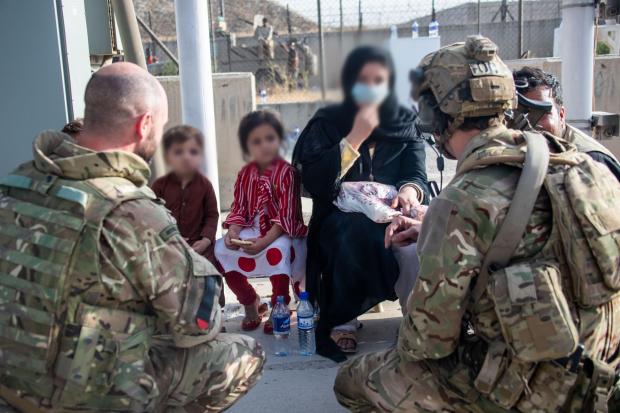 Gazette: EDITORS NOTE IMAGE BLURRED AT SOURCE Handout photo issued by the Ministry of Defence (MoD) of members of the UK Armed Forces who continue to take part in the evacuation of entitled personnel from Kabul airport. Issue date: Monday August 23, 2021. Defence