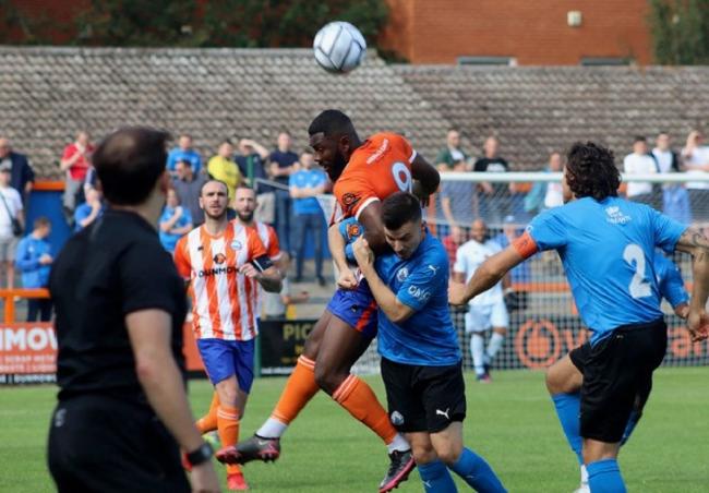 Heads up: Braintree Town's Femi Akinwande in action against Billericay Town Picture: ALAN STUCKEY