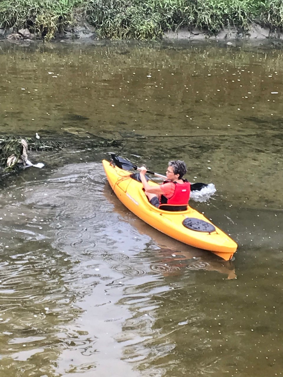 Tracy Martinez in the river with her kayak