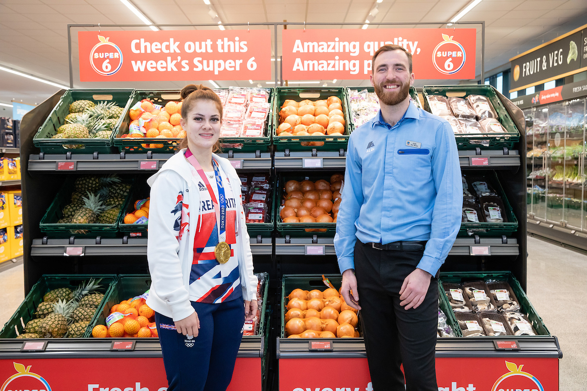 Store manager Karl Mitchell with Olympian Bethany Shriever at the Grand opening of Aldi Colchester
