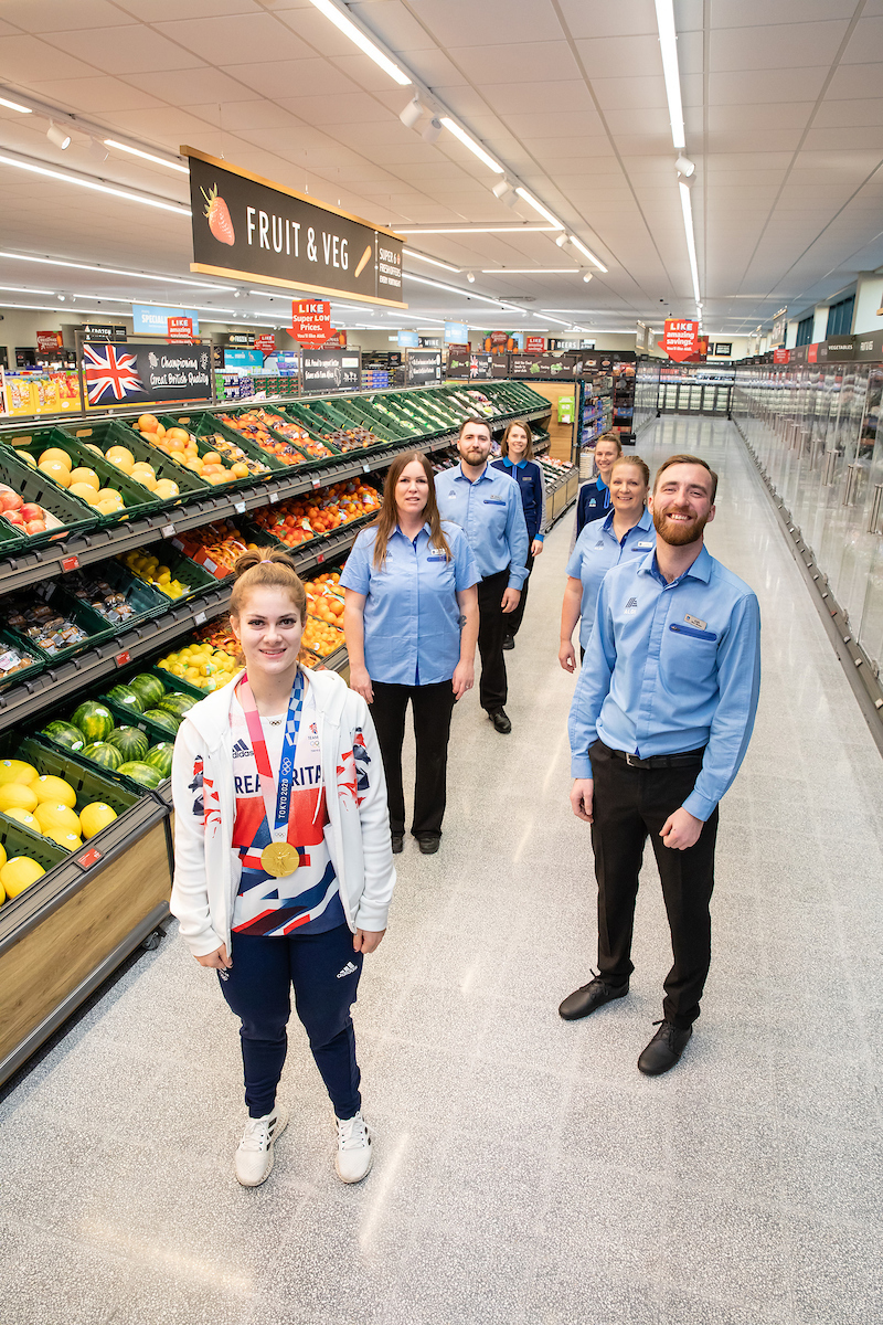 Store manager Karl Mitchell with Olympian Bethany Shriever and staff members at the Grand opening of Aldi Colchester