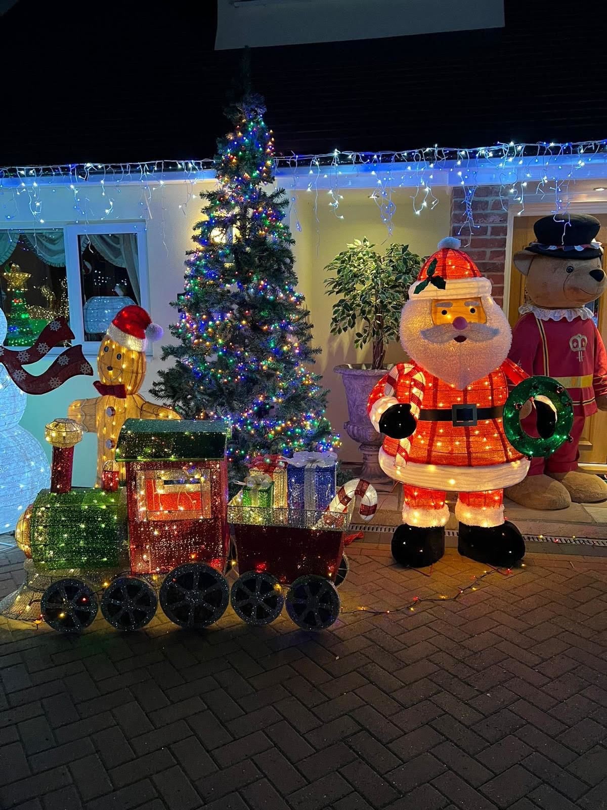 Lit-up - The decorations and lights stretch inside and outside of her house-turned-grotto