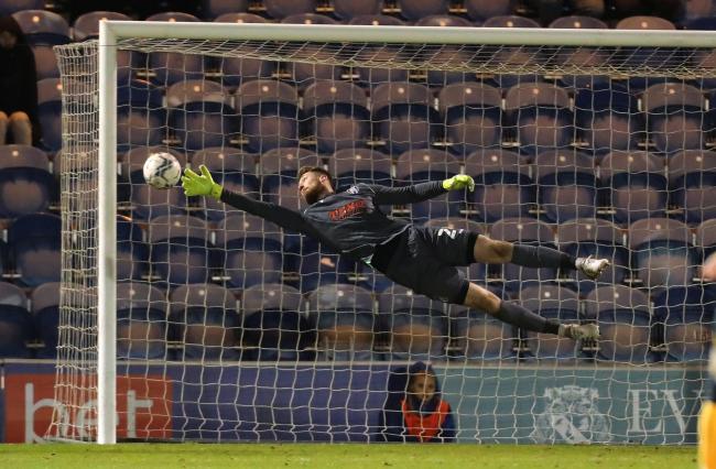 Full stretch - Colchester United goalkeeper Jake Turner makes another save against Newport County Picture: STEVE BRADING