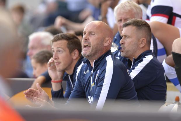 New role - new Ipswich Town interim boss John McGreal pictured during his time as Colchester United head coach, with Rene Gilmartin on his right Picture: STEVE BRADING