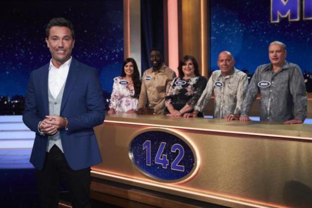 Gazette: Michael Baah, girlfriend Kate Mills, and her family won £10,000 on the TV quiz show Family Fortunes Photo by ITV